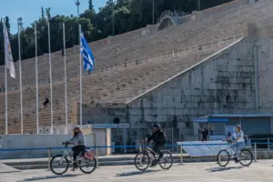 The all-marble Panathenaic Stadium Kallimarmaro in Athens with a Solebike tour group on electric bikes.