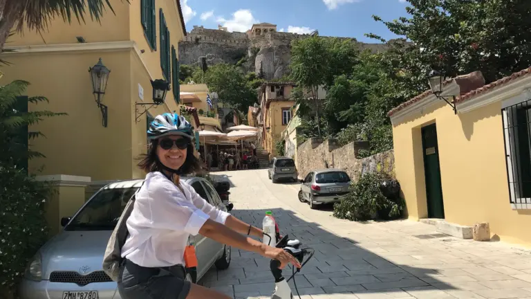 Female rider on an eBike tour in Plaka below the Acropolis