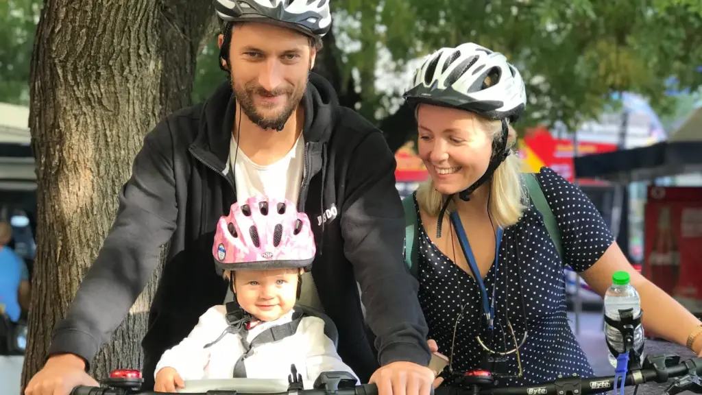 Parents with baby in front bike seat before a family eBike tour in Athens