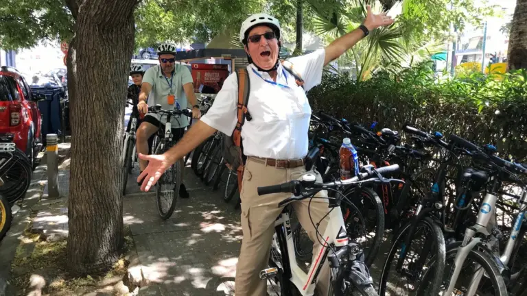Joyful senior rider on a pedal-assist eBike during an Athens city tour