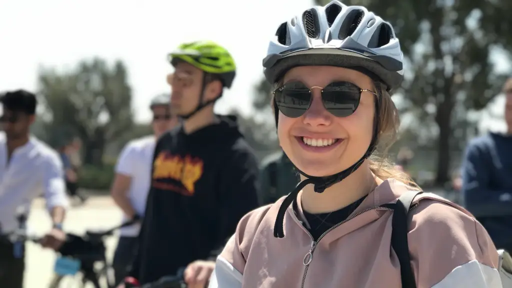 Smiling woman wearing a helmet on an Athens eBike tour
