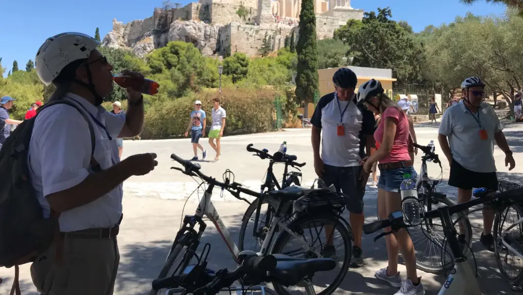 Group of riders taking a water stop at Areopagus during an Athens shore excursion