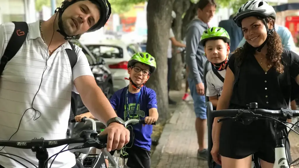 Young parents with children ready to start a family eBike tour in Athens