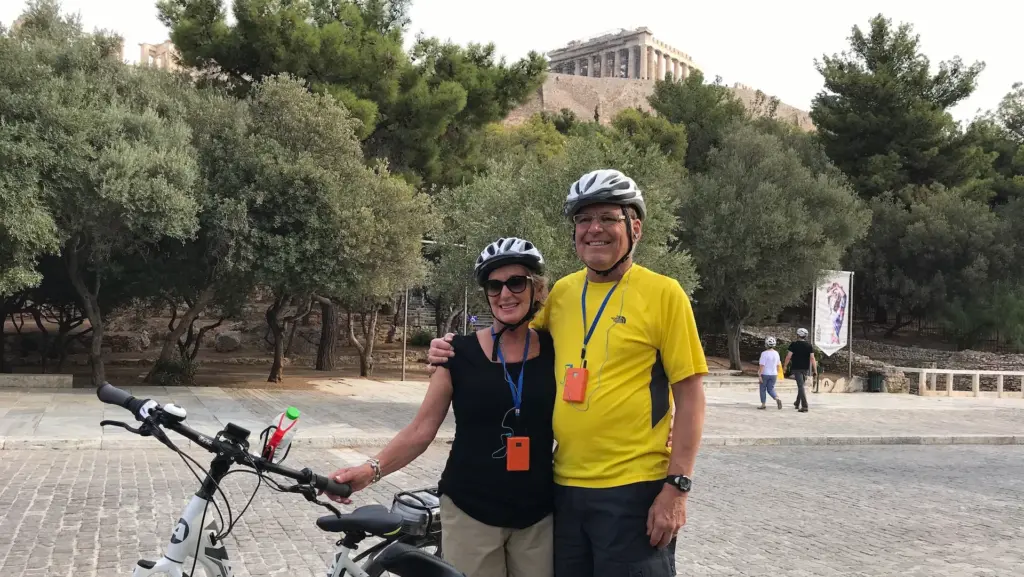 Couple with eBike near the Acropolis during an Athens eBike shore excursion tour