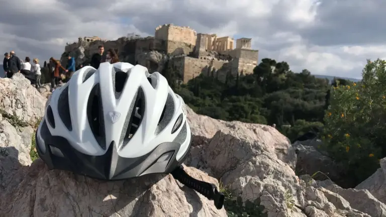 Bike helmet on the rocks of Areopagus Hill with the Acropolis in the background