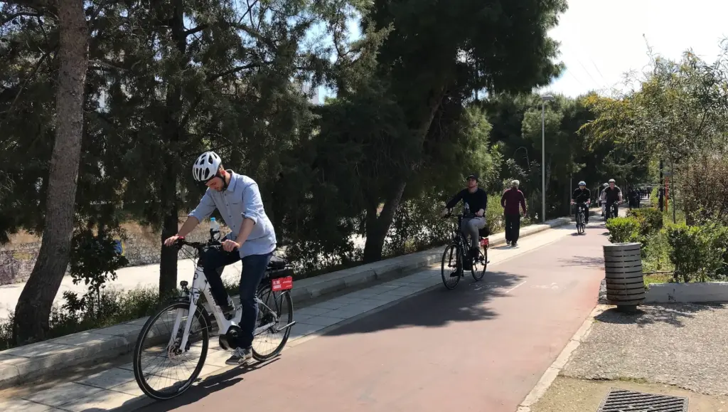 eBike riders cycling along an Athens bike lane during the Athens Riviera Coffee Ride