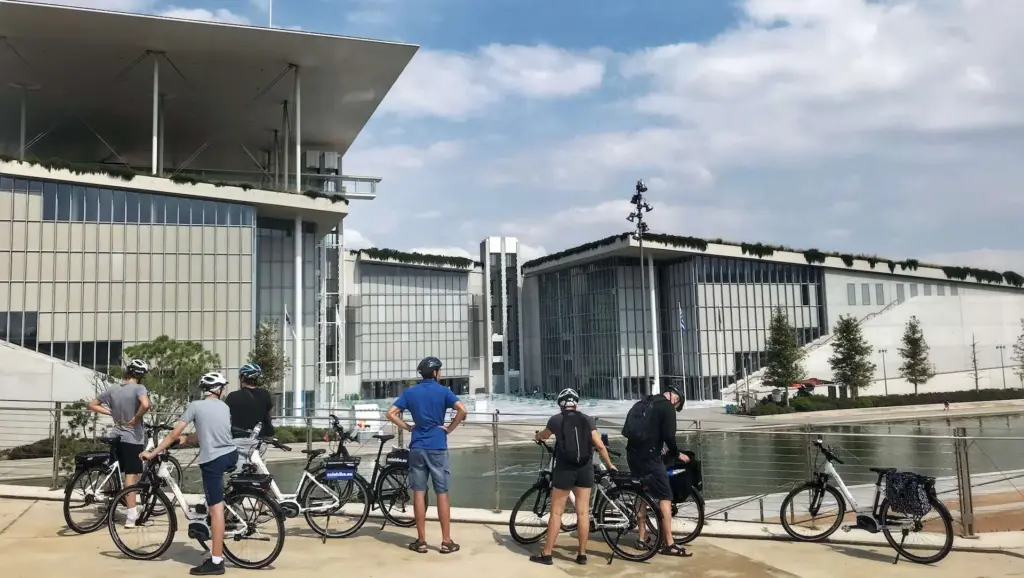 eBike riders توقف at the Stavros Niarchos Foundation Cultural Center during the Athens Riviera Coffee Ride