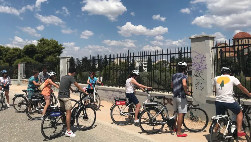 Riders with eBikes beside the Kerameikos archaeological site during an Athens tour