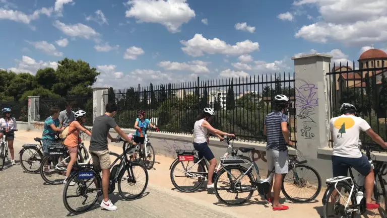 Riders with eBikes beside the Kerameikos archaeological site during an Athens tour