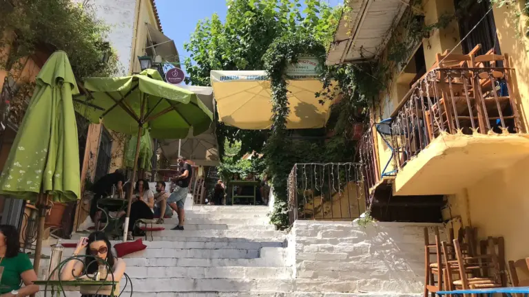 Cafés and whitewashed steps on Mnisikleous Street in Plaka, Athens