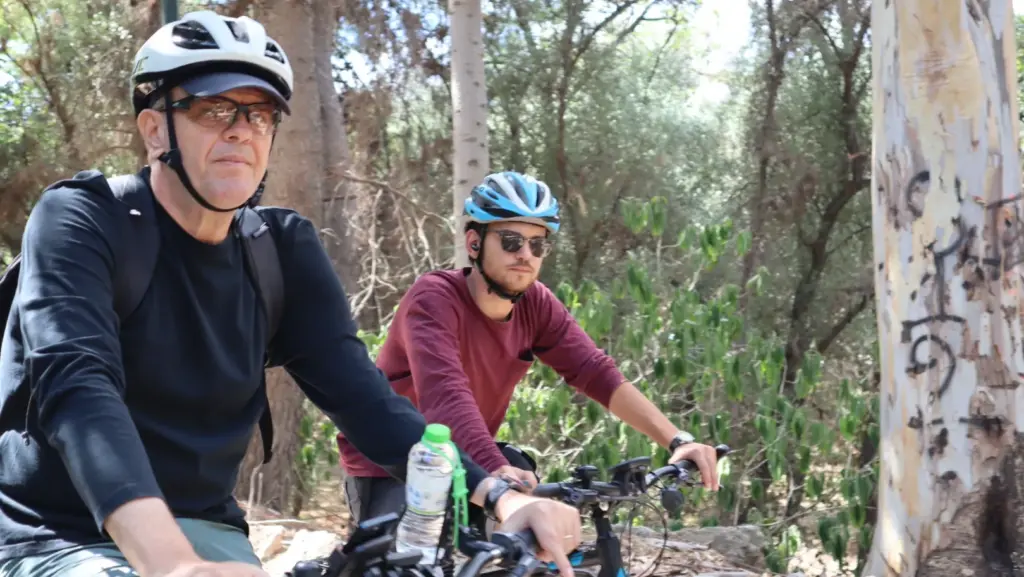 eBike tour guests riding through the wooded Plato’s Academy area in Athens