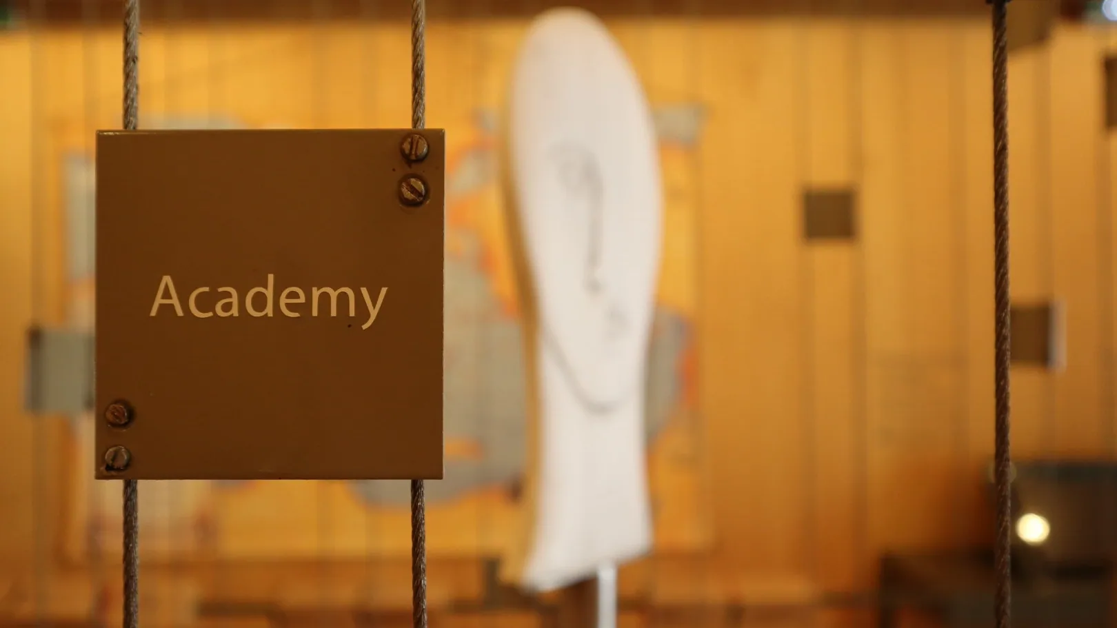 Close-up of an Academy exhibit sign at Plato’s Academy Museum in Athens