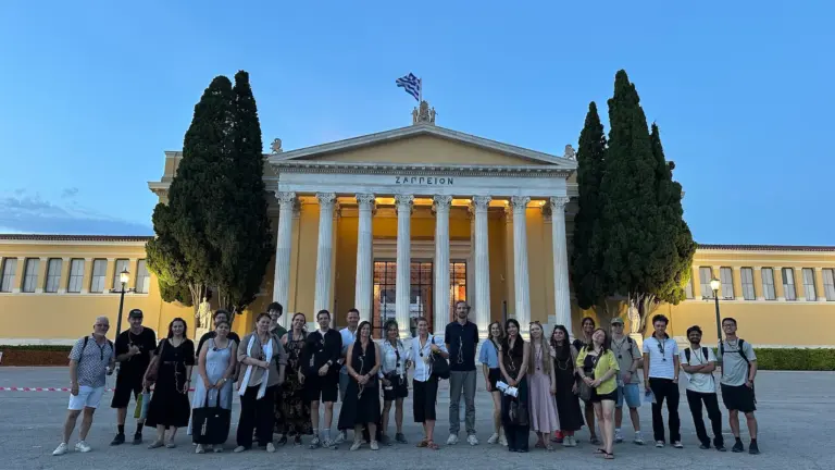 Academic architecture tour group standing in front of Zappeion in Athens at evening time